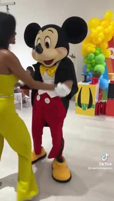 Mickey showing off his Bachata moves.
