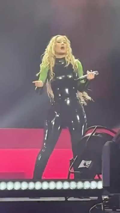 Iggy Azalea moving around in skintight leather jumpsuit