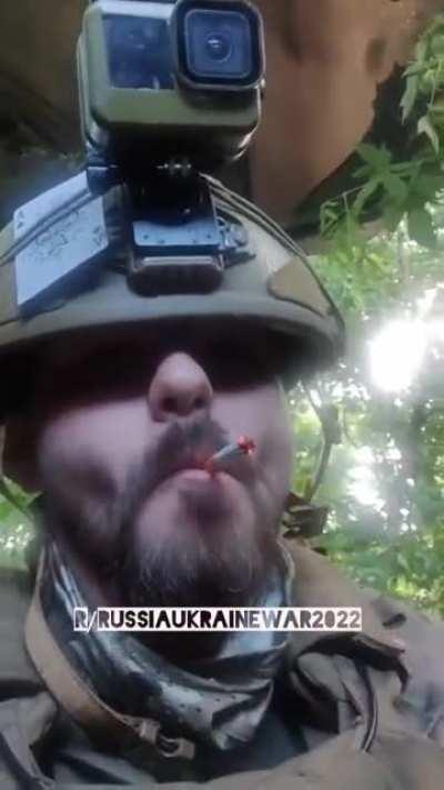 Ukrainian soldier hits the deck and then smokes a cigarette to settle his nerves during Russian strikes