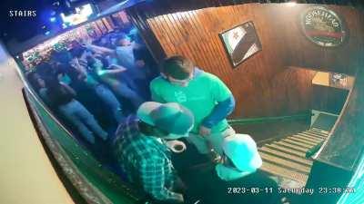 Mercyhurst University hockey player pushing a disabled student’s wheelchair down a flight of stairs while she’s using the bathroom