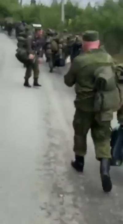 Ru pov: Hundreds of servicemen are seen marching, from Molkino/Krasnodar to be mobilised to the SMO zone