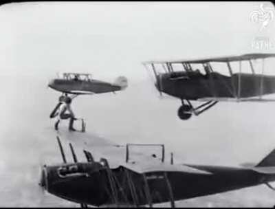 A woman replaces the wheel of a plane mid-flight.