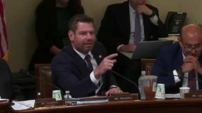 Kristi Noem repeatedly refuses to acknowledge that Trump brandished an doctored image of Abrego Garcia's tattoos, prompting Eric Swalwell to have a staffer of his display an image of them at her