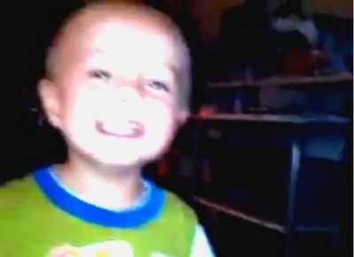 Posting for friend not on Reddit. Recorded son dancing and upon watching it sees another child. At 34sec child turns and makes contact with apparition. Follow it as it disappears to the right into other room.