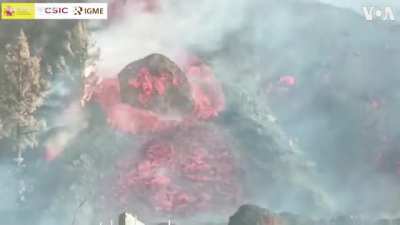 Gigantic bolder slides down La Palma magma river.l
