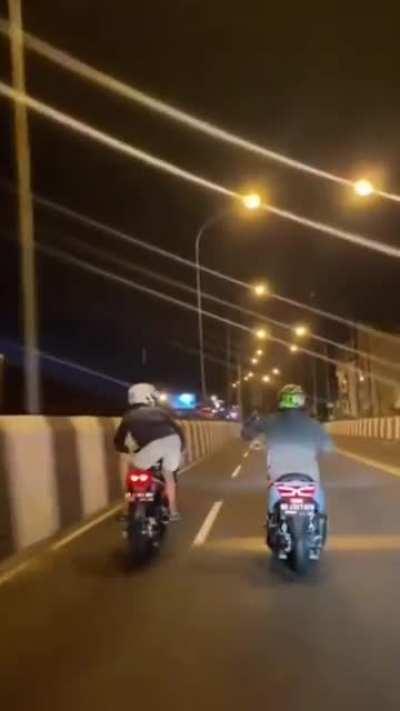 2 guys playing while riding a motorcycle then crashed.