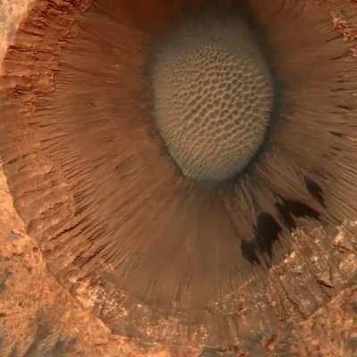 A 1-mile-wide (1.5km) impact crater on Mars, captured by the HiRISE camera on the Mars Reconnaissance Orbiter from 160 miles (257 km) above the planets surface.