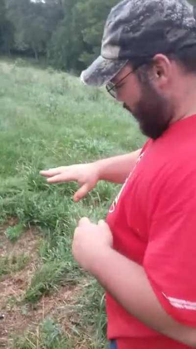 Trying to one hand a deer slug.