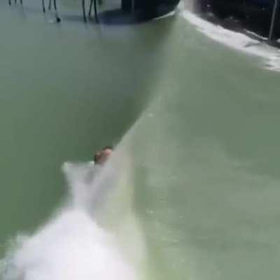 Riding under the wave