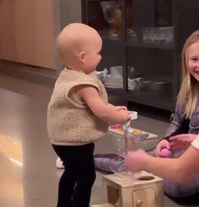 Big sisters overjoyed to see baby brother’s first steps
