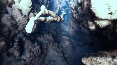 Crazy Freediver Stig Pryds dives down a 30 meter deep canyon