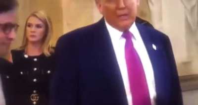 Karoline Leavitt gestures to have black capital police removed from stage