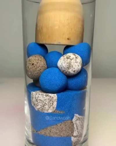 Kinetic sand being smashed in glass, it’s the video I didn’t know I needed! @sandwoah on Instagram