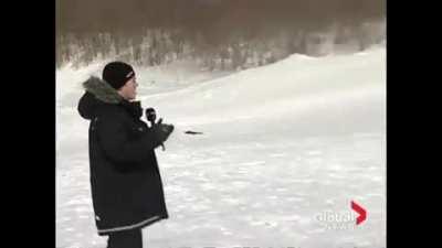 WCGW standing in front of racers on sleds
