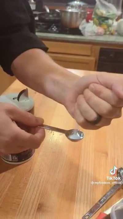 chef gets tattoo so he can always measure an exact tsp or tbl on his hand.