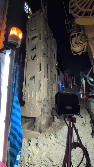 An excavator on the streets of Bangkok tonight
