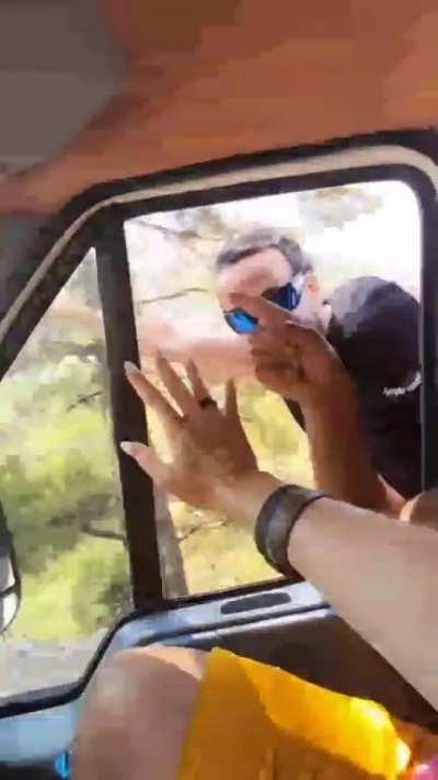 Ah yes, leaning out of a moving vehicle is totally safe