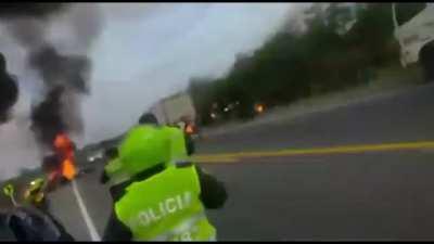 Fuel truck that fell catches on fire while people are looting it