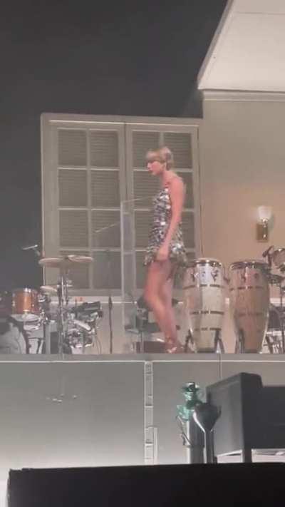 Taylor on stage in London today in a VERY short dress!