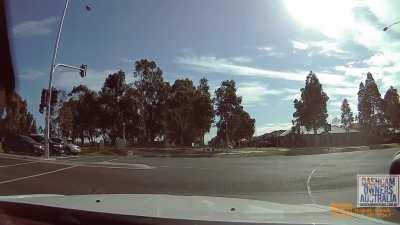 Motorbike hits car after running red light