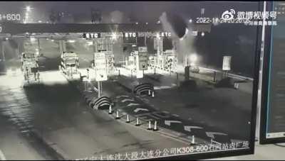 Car goes airborne at tollbooth