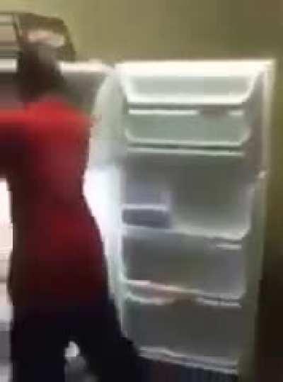 Drunk man fights fridge