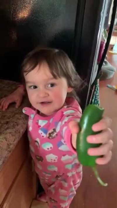 Little kid eats a jalapeño