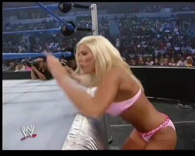 Torrie Wilson ringside in a pink bikini