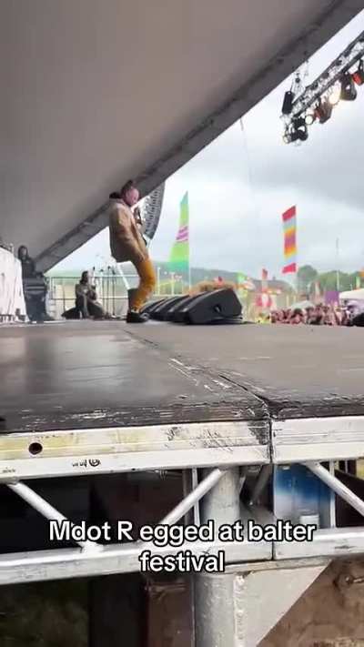 Dancehall artist pelted with tomatoes and eggs while on stage