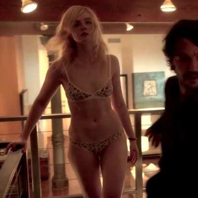 Elle Fanning getting help undressing