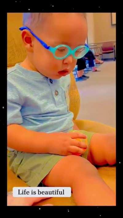 These babies trying out corrective glasses for the first time in their lives