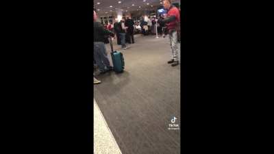 Man performs a musical at the Airport