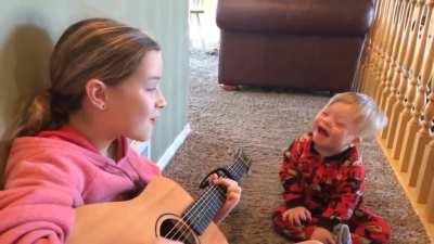 This girl singing “you are my sunshine” to her little brother with Down’s syndrome is the sweetest thing I have seen in years.