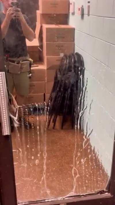 Definitely not a ghost cleaning a mirror