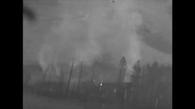 Plane strafes a ammunition train and flys through the explosion in WW2