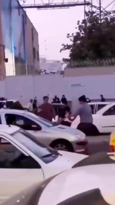 Iranian police flykicked while trying to take a teenage protestor