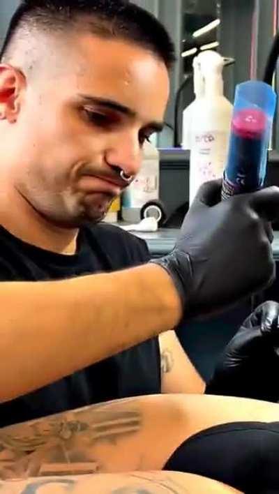 Tattoo artist finds himself in a... precarious position.
