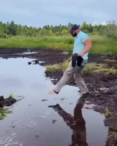 He is making Sure that's his shoes are not getting dirty