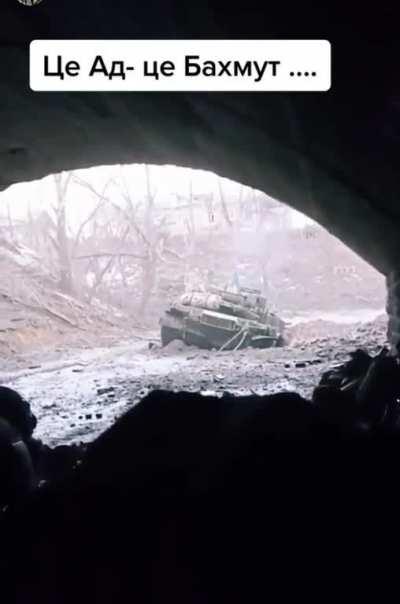 Bakhmut. Ukrainian Tank was knocked out by Russian forces. Crew managed to take shelter nearby. Tank received another hit at 0:09. Looks like Russians were trying to finish her off.