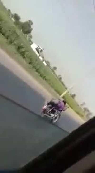 WCGW doing stunts on a bike