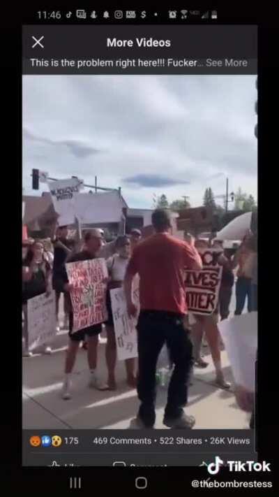Man curses at peaceful protestors and gets angry when none fight back.