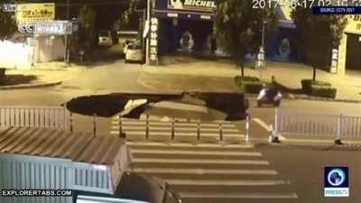 Biker drives up to a sink hole, then falls in (r/shortclips)