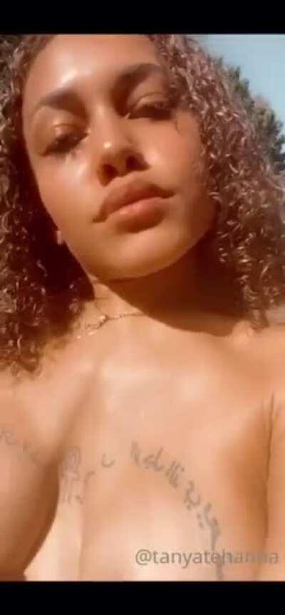 Tanya Tehanna shows off her sun kissed skin and exposes her supple breasts