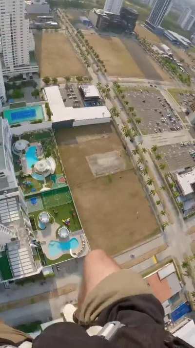 This parachute jump, using a building is incredibly dangerous because there have been cases where the buildings are not tall enough so the parachute does not deployed. 