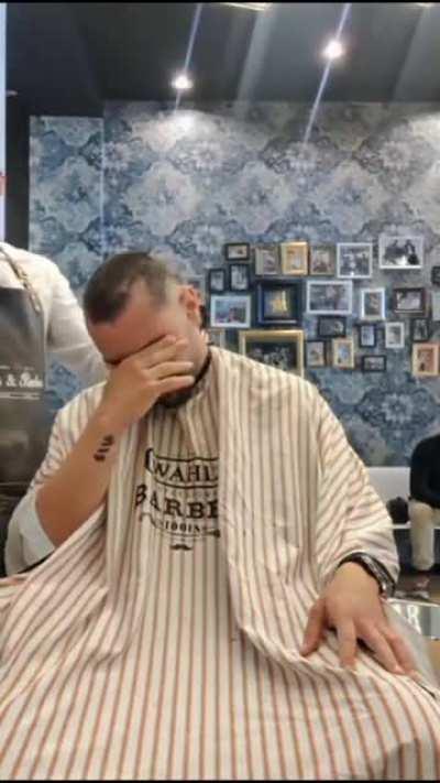 Barber shaves his own hair to support his buddy fighting cancer.