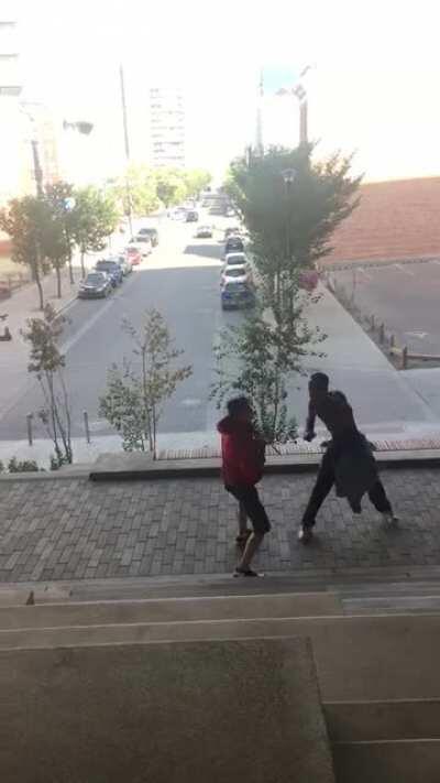 Beef at Central Library this afternoon. The guy in the red had a knife and was about to stab the guy with no shirt. After I pulled out my camera the guy in the red noticed and let go of being dominant. You can see him hiding his knife in his hoodie pocket