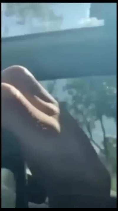 idiots light a firework in their car..