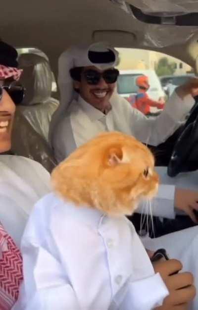 An orange boy dressed to the nines, for Ramadan