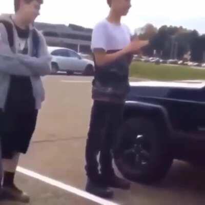 Man roundhouse kicks a car window to shards after being called an n-slur