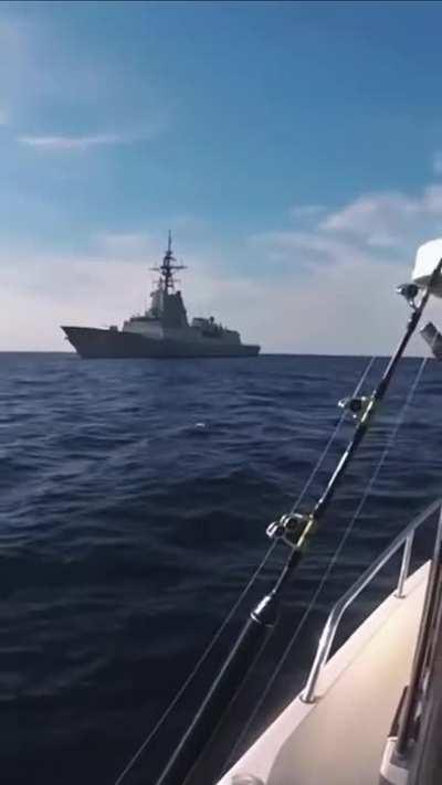 That feeling when you and the boys are enjoying a day of deep sea fishing… then HMAS Hobart rocks up.
